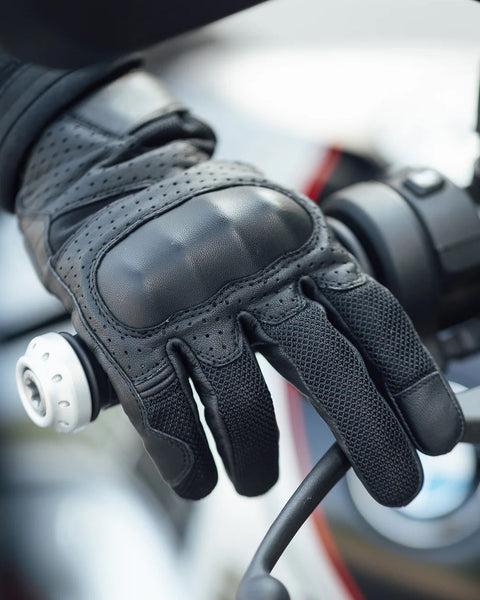 Merlin Griffin Leather Gloves - Black worn by model holding motorcycle grip
