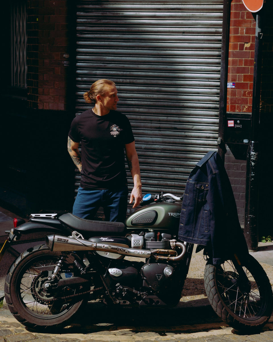 Model wearing black motorcycle graphic t-shirt